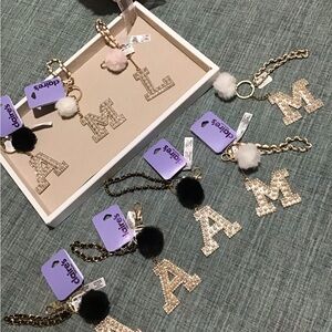 Beautiful Claire’s Designer Inspired Keychains.All Brand New.Only HaveA,L&M🌺